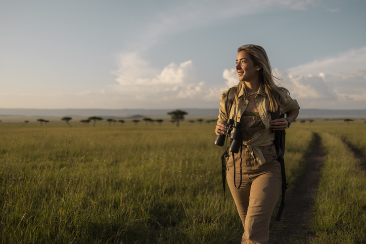 Woman on a walking safari with binoculars