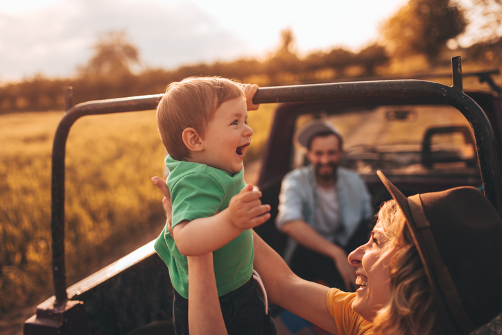 Woman holding baby on a luxury family safari